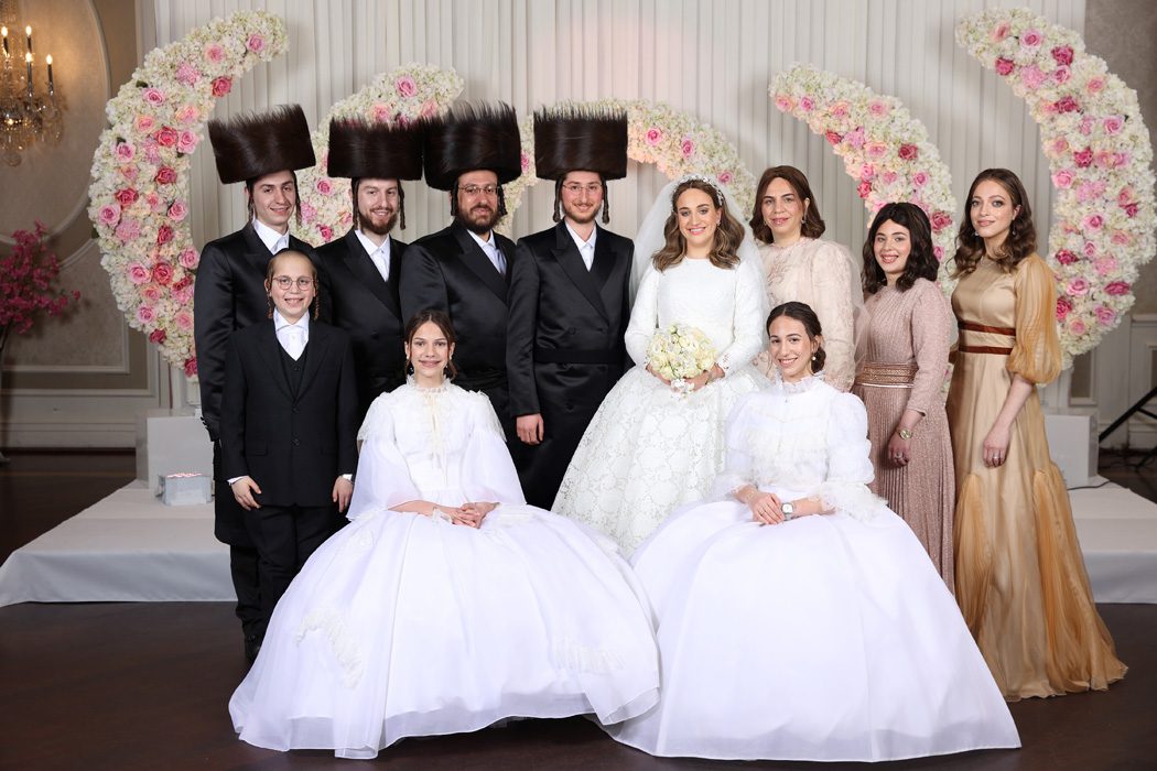 Bride and groom added to a family photo: after retouching